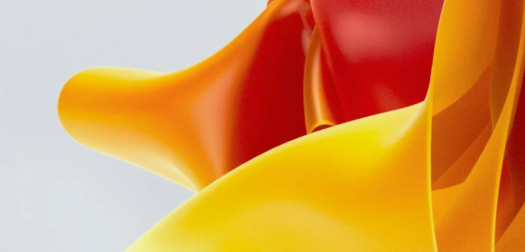 Abstract image of vibrant red and yellow flowing shapes on a light background, symbolising momentum, energy, and the dynamic impact of ai-driven decisions.
